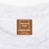 Zakelijke tagline op bruin vierkant ijzer op label (Aangebracht)