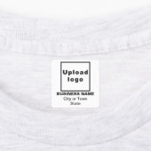 Zakenmerk op wit vierkant strijkijzer op label (Aangebracht)