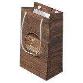 Zakje met bruiloftfavor voor op een rustieke houte (Achterkant Gekanteld)