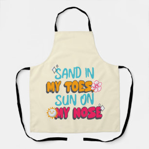 Zand in mijn tenen, zon op mijn neus schort