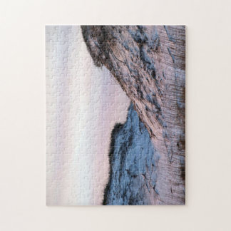 Zandduinen bij zonsondergang op een legpuzzel