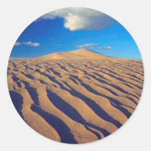 Zandduinen en wolken ronde sticker