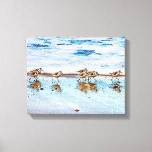 Zandpiers die langs de strand lopen canvas afdruk