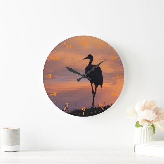 Zandtapkraansilhouet op zonsondergang grote klok (Huis)