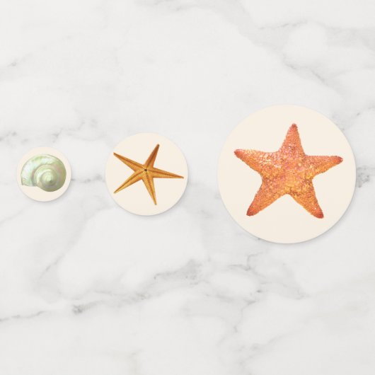 Zee oesterschalen, sterren en parels op ivoortafel confetti (Achterkanten)