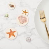 Zee oesterschalen, sterren en parels op ivoortafel confetti (Groep)