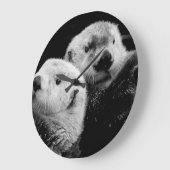 Zee otters: zwart wit paar. grote klok (Hoek)