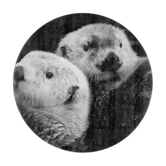 Zee otters: zwart wit paar. snijplank (Voorkant)