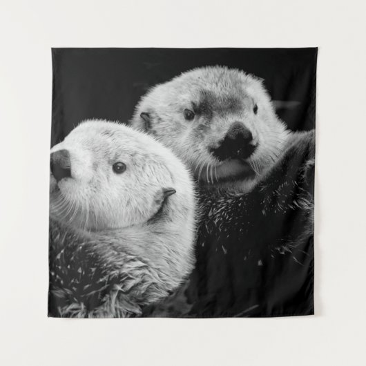 Zee otters: zwart wit paar. wandkleed (Voorkant)