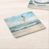 Zeemeeuwen die op een strand vliegen kartonnen onderzetters (Schuin)