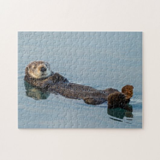 Zeeotter drijft op rug in oceaan legpuzzel (Horizontaal)