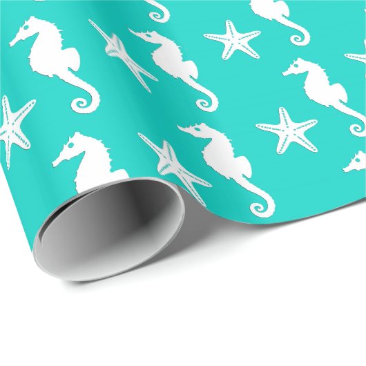 Zeepaardvis - wit op turquoise cadeaupapier (Rol Hoek)