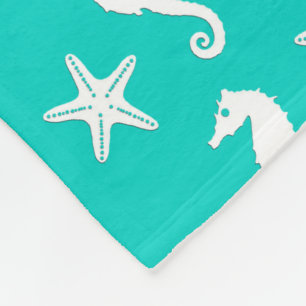 Zeepaardvis - wit op turquoise fleece deken