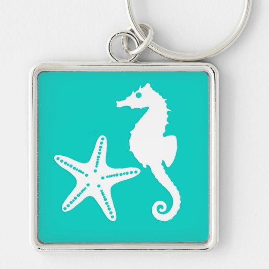 Zeepaardvis - wit op turquoise sleutelhanger (Voorkant)