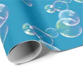 zeepbellen op blauw cadeaupapier