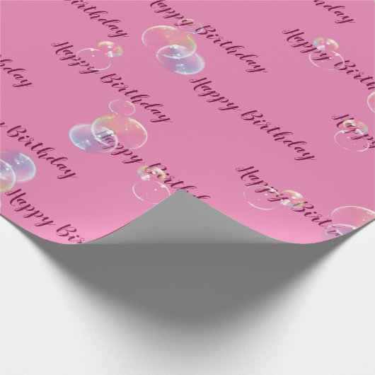 zeepbelletjes op roze cadeaupapier (Hoek)