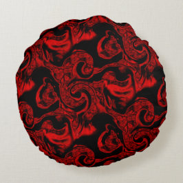 Zeer gekleurde rode spiraaldelen op zwarte achterg rond kussen