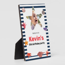 Zeeschelpen, zeesterren en koraal op nautische str fotoplaat