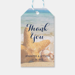 Zeesterren en zeeschelpen op het strand Dank u Cadeaulabel