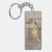 Zeg wat je bedoelt, bedoel je wat je zegt sleutelhanger (Voorkant Links)