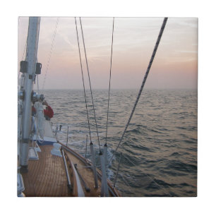 Zeilen bij zonsondergang tegeltje