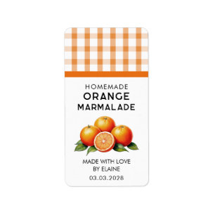 Zelfgemaakte oranje marmelade met geruit patroon etiket