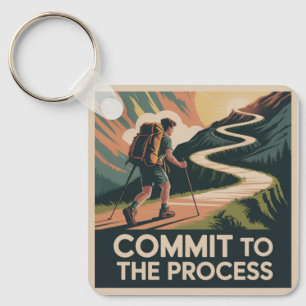 Zich aan het proces committeren sleutelhanger