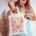Zijn ik hem in het bruidsmeisje zijn ik gepersonal tote bag<br><div class="desc">Introductie van de "It's Me Hi I'm the Maid of Honor" gepersonaliseerde Canvas tas - de perfecte mix van stijl en functionaliteit voor uw gewaardeerde Maid of Honor. Deze trendy en schattige perzik koraal roze canvas tas is niet alleen een accessoire; het is een statement stuk dat het belang van...</div>