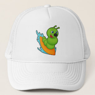 Zijpijler als surfer met surfplank trucker pet