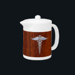 Zilver als Caduceus Medical Symbol Mahogany Print Theepot<br><div class="desc">Het symbolische zilver zoals het medische symbool Caduceus, hier voorgesteld op een mahogany houten achtergrond. De caduceus-slangen zijn zo ontworpen dat ze eruit zien alsof ze van chroom zijn gemaakt. Goed voor een afstuderen, een verklaring voor je beroep, of voor een cadeau met die medische zorg die je zoekt. Gebruik...</div>