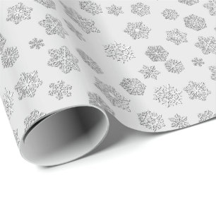 Zilveren 3 Dsneeuwvlokken op een zilveren Cadeaupapier