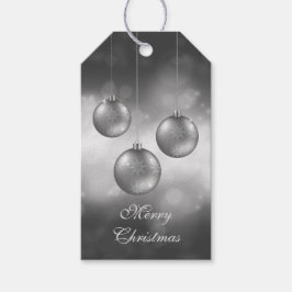 Zilveren grijze kerstballen op rode bokeh cadeaulabel