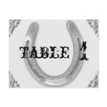 Zilveren Hoefijzer op witte huwelijkstafel nummer