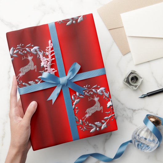 Zilveren kerstgeschut en rendier cadeaupapier