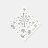  zilveren kerstsnowflakes op winterwit servet (Hoek)