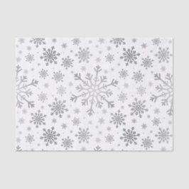  zilveren kerstsnowflakes op winterwit tissuepapier