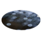 Zilveren, witte bokeh nacht achtergrond. snijplank (Hoek)