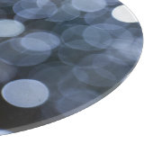 Zilveren, witte bokeh nacht achtergrond. snijplank (Hoek)