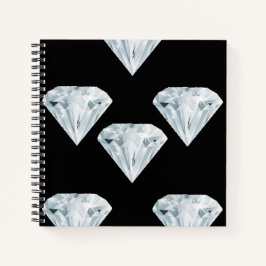 Zilverige glanzende diamanten op zwart notitieboek