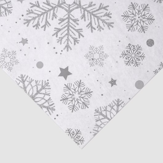 Zilversneeuwvlokken op wit tissuepapier (Detail)