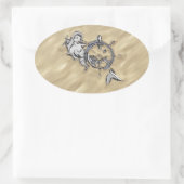 Zilverzeemeermin in de zand ovale sticker (Tas)