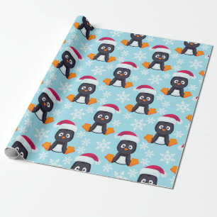 Zittende pinguïn in kerstmuts cadeaupapier