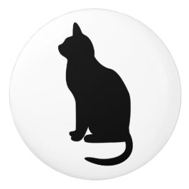 Zittende zwarte kat naar links gericht keramische knop