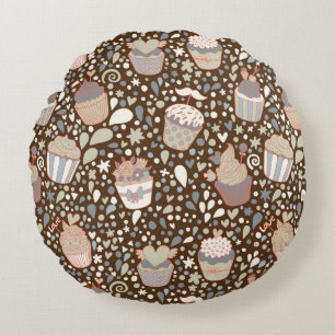 Zoet patroon gemaakt van smaakvolle cupcakes rond kussen