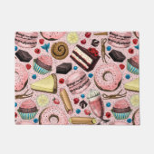 Zoete lekkernijen op roze deurmat (Voorkant)