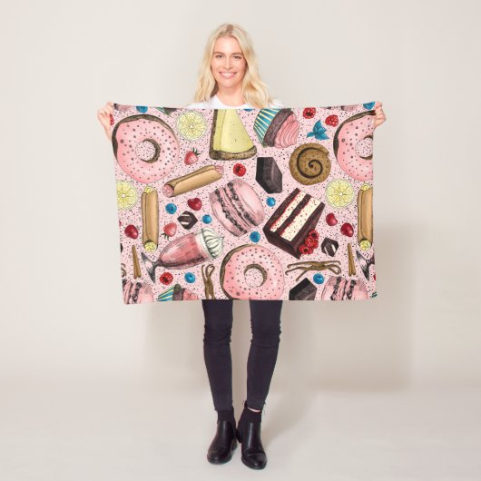 Zoete lekkernijen op roze fleece deken (In situ)