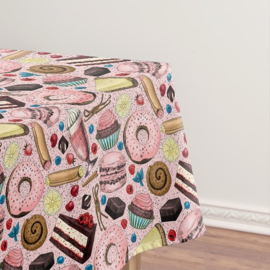 Zoete lekkernijen op roze tafelkleed (Voorbeeld)