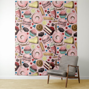 Zoete lekkernijen op roze wandkleed