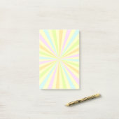 Zoete pastels draaiende wiel barst uit post-it® notes (Op bureau)