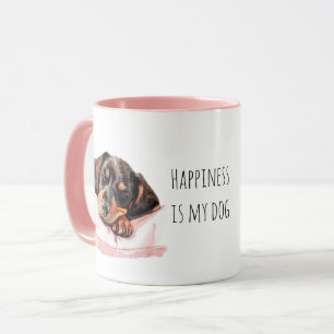 Zoete slapende zwarte crème puppy hond mok